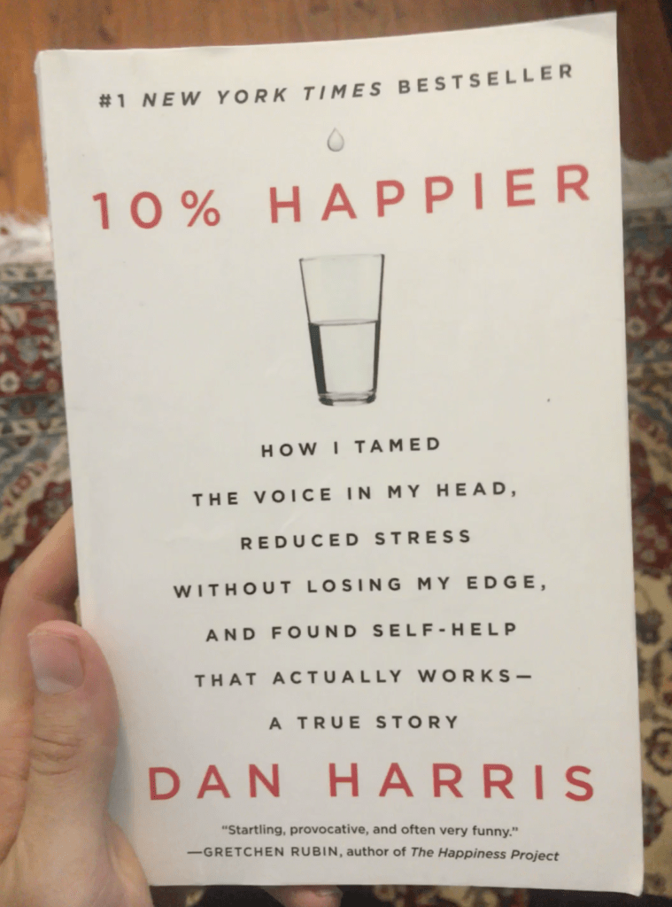 david smart holding the book 10% happier by dan harris