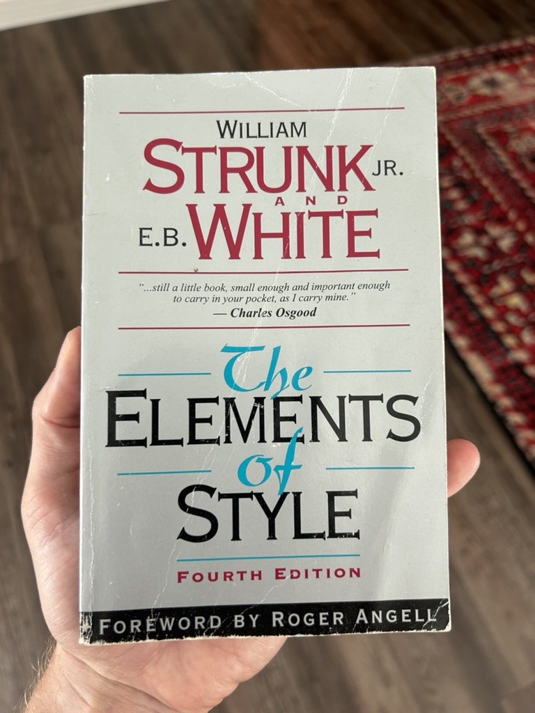 david smart holding the book the elements of style by william strunk and e.b. white