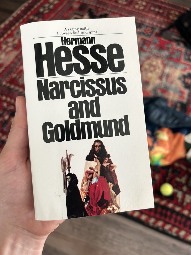 david smart holding the book narcissus and goldmund by herman hesse